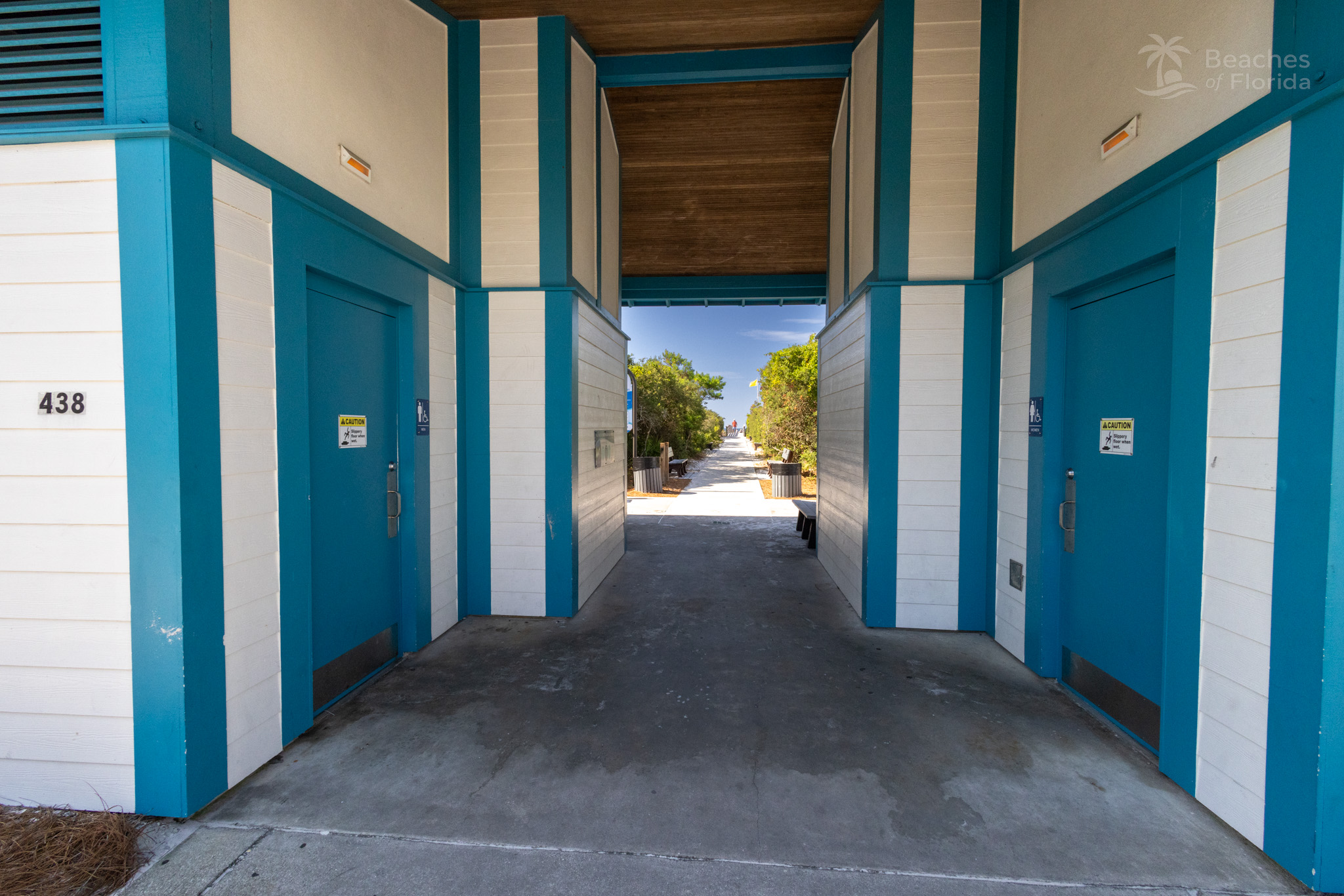 Public restroom facility with beach access walkway at Inlet Beach