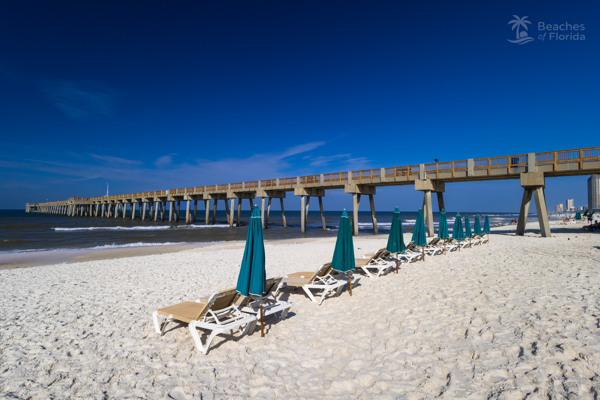 Beach chair rentals and umbrellas near the pier at Panama City Beach